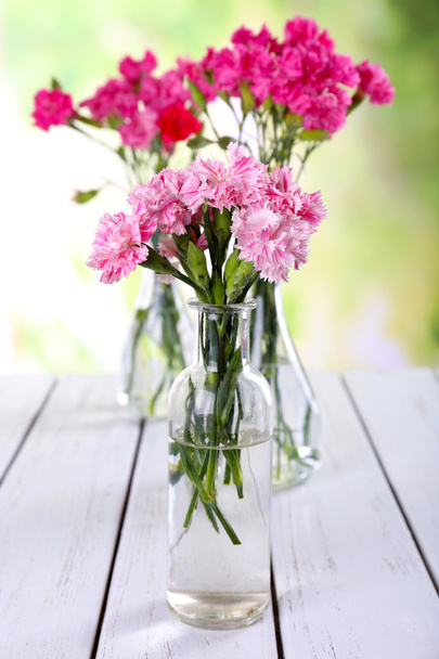 bouquet of pink carnation in vases - Fotoğraf, Görsel