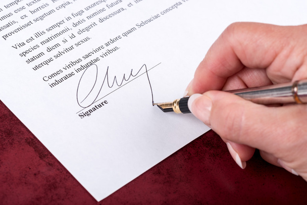 Hand signing a contract - Photo, Image
