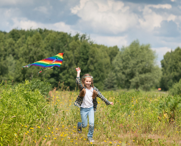 little cute girl flying a kite  - Photo, image