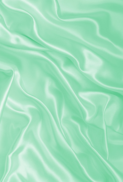 Smooth elegant green silk or satin texture as background - Fotó, kép