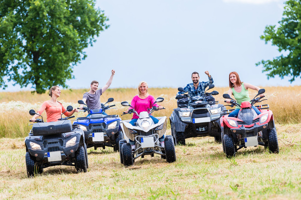 Friends driving off-road with quad bike or ATV - Photo, Image