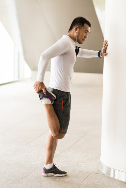 man stretching legs before running - Foto, imagen
