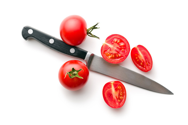 chopped tomatoes and knife - Fotó, kép