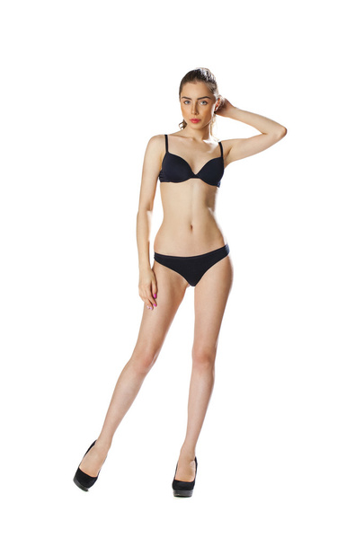 Full length portrait of a beautiful young model in black bikini  - Фото, изображение