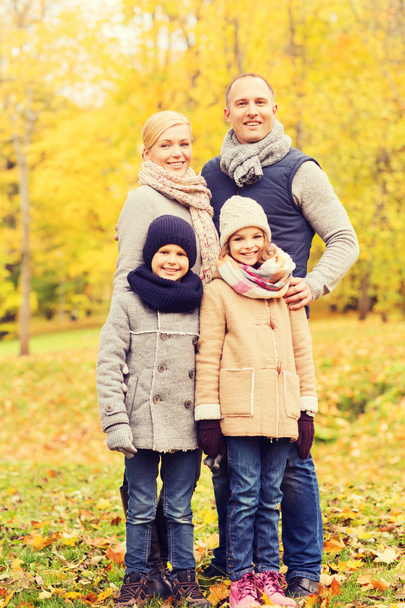 happy family in autumn park - Foto, imagen