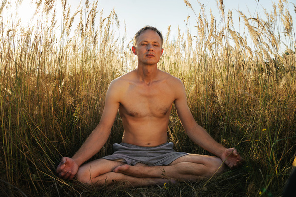Man meditating - Photo, Image