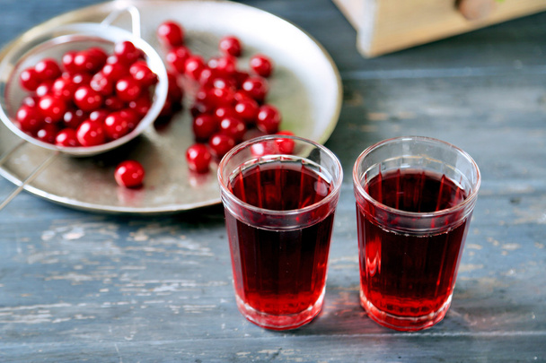 Sweet homemade cherry juice on table, on light background - Foto, Imagem