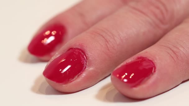 Woman applies transparent nail polish - Footage, Video