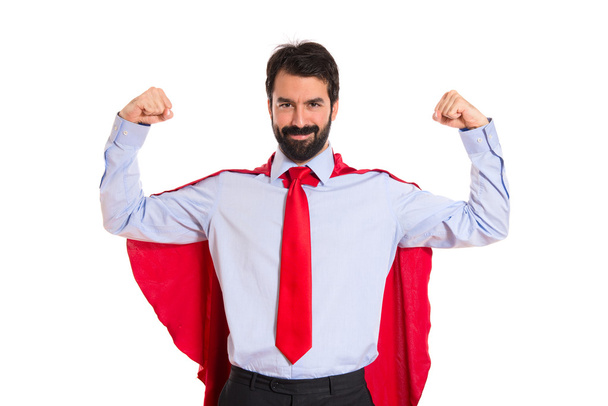 Zakenman gekleed als superheld met duim omhoog  - Foto, afbeelding