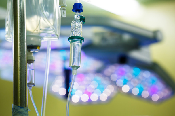 IV drip hanging on a pole in hospital - Foto, afbeelding