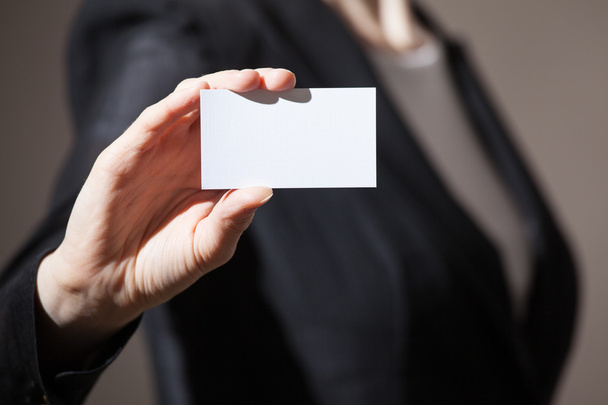 Businesswoman's hand showing business card - Photo, Image
