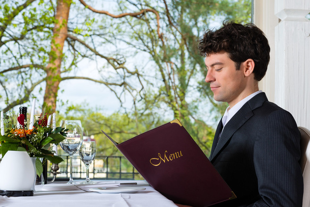 Businessman have a lunch in restaurant - Foto, Imagen