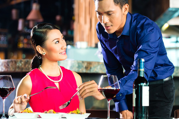 Portrait of Asian couple eating in restaurant - Photo, Image