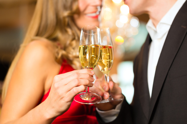 Man and woman tasting Champagne in restaurant - Photo, Image