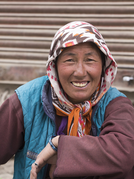 Indian beggar woman on the street in Leh, Ladakh. India - 写真・画像