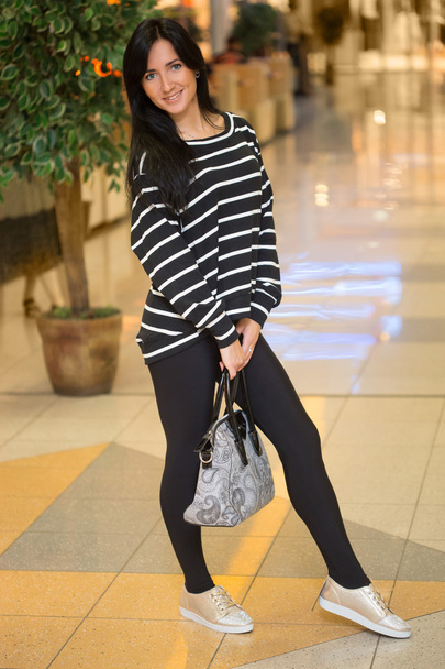 girl in a striped blouse with a bag - Photo, Image