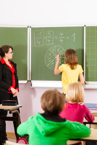 Education - teacher with pupils in school teaching - Fotoğraf, Görsel