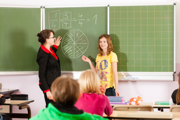 Education - teacher with pupils in school teaching - Fotografie, Obrázek