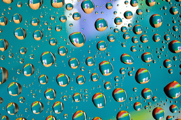 Water drops on colored background - Photo, Image