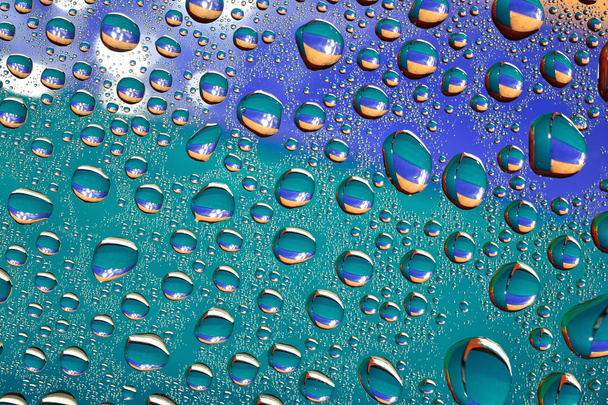 Water drops on colored background - Foto, afbeelding