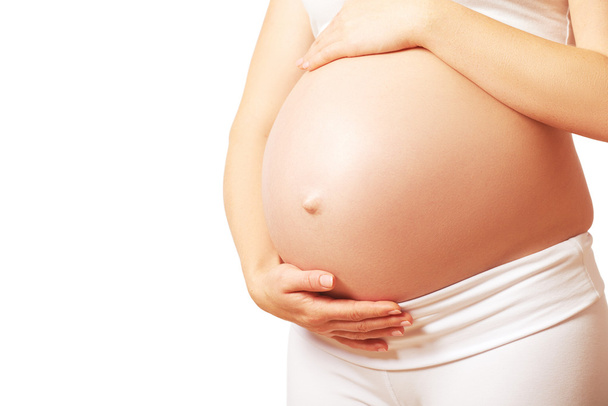belly tummy of  pregnant woman on white background - Φωτογραφία, εικόνα