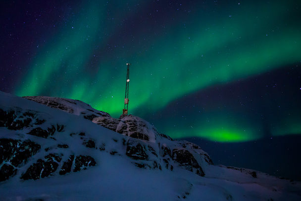 Luzes do norte em Groenlândia
 - Foto, Imagem