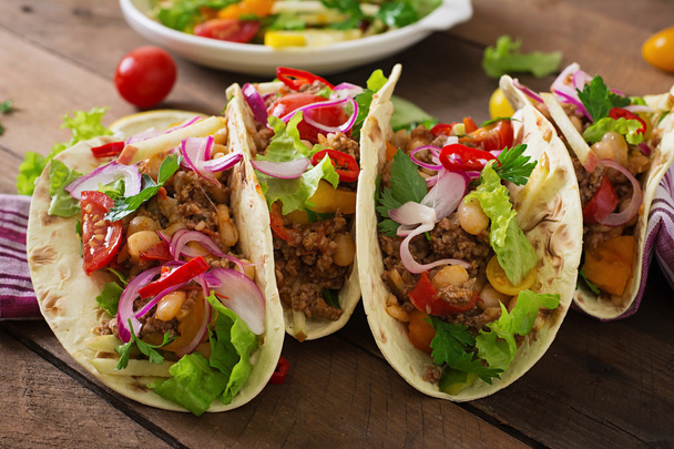 Mexican tacos with meat, beans and salsa - Photo, Image