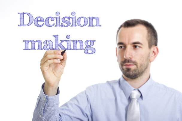 Decision making - Young businessman writing blue text on transparent surface - Fotografie, Obrázek