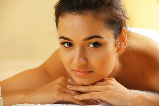 Young woman on massage table  - Foto, imagen