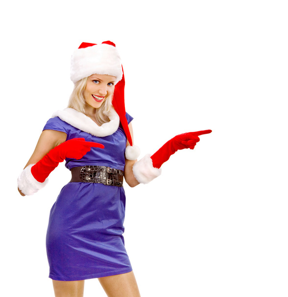 Sexy Girl dressed as Santa Claus Points Finger to Copy Spaces - Foto, imagen