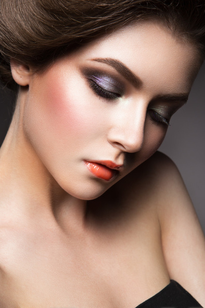 Beautiful young model with bright make-up - 写真・画像
