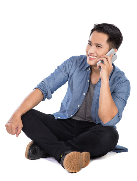 Young asian man speaking on the phone, isolated - Φωτογραφία, εικόνα