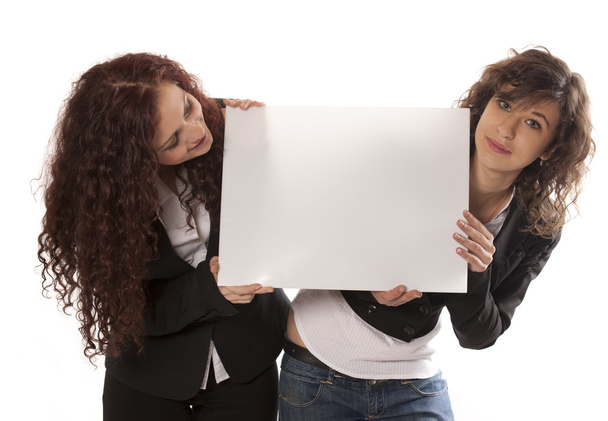 Young women holding billboard - Foto, Imagen