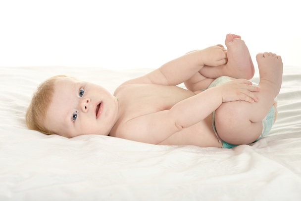 Adorable baby boy in pampers - 写真・画像