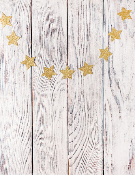 Christmas stars on  wooden background - Foto, afbeelding