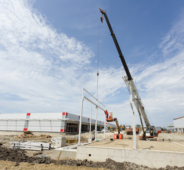 Crane lifting metal beam - Photo, Image