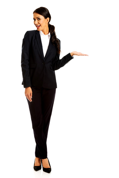 Businesswoman holding copy space - Photo, image