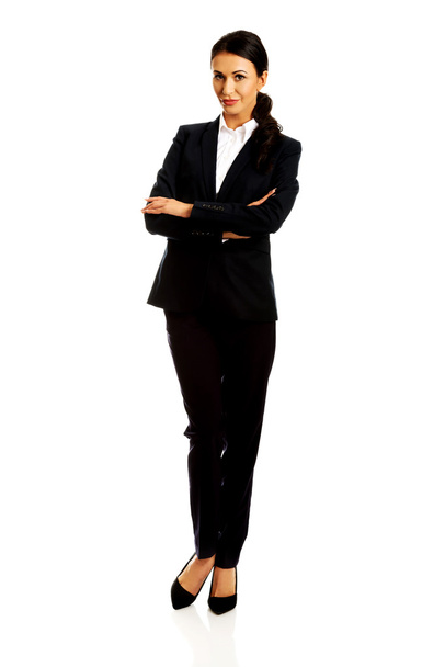 Businesswoman standing with folded arms - Photo, Image
