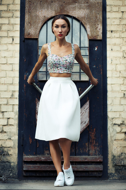 woman in stylish skirt and crop top - 写真・画像