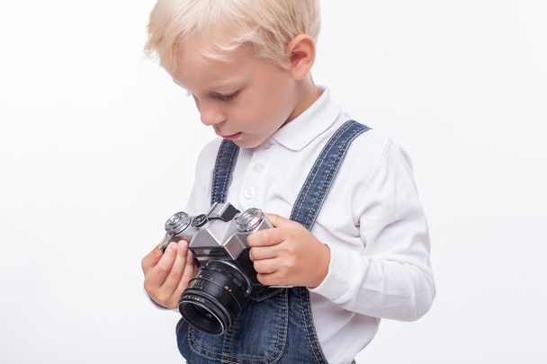 Cheerful small boy is preparing for making photos - Photo, Image