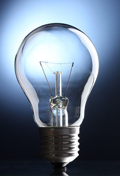 Light bulb on blue background - Foto, immagini