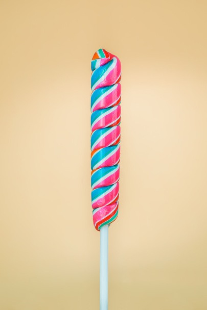Lollipop shaped rods on a cream background - Valokuva, kuva