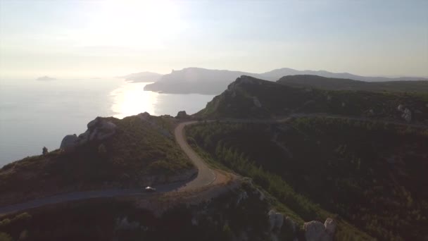 AERIAL: Driving along the road on top of high ocean cliffs - Footage, Video