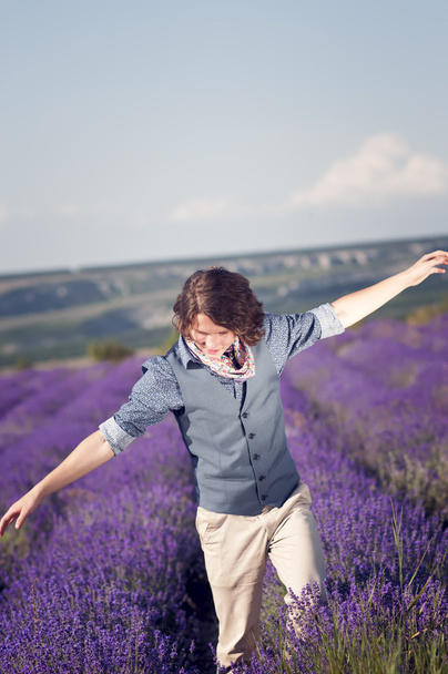 Attractive young man among the lavender fields. - Photo, Image