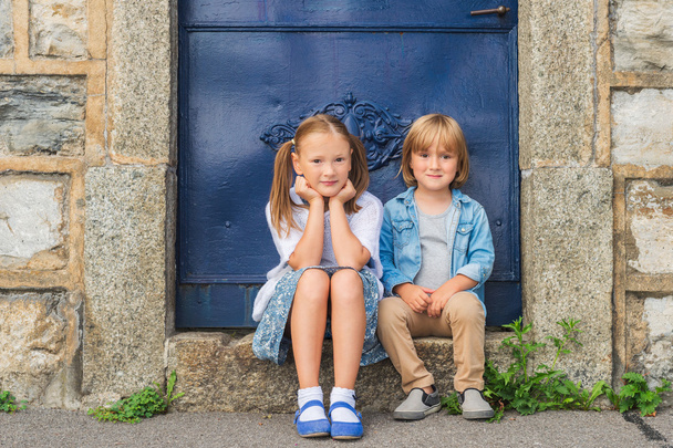 Outdoor portrait of a little girl and her brother - Photo, Image