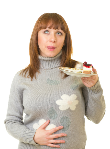 Kaunis nuori nainen syö maukasta kakkua
 - Valokuva, kuva
