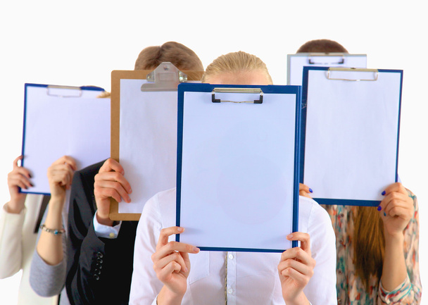 Team of businesspeople holding a folders near face isolated on white background - Photo, Image