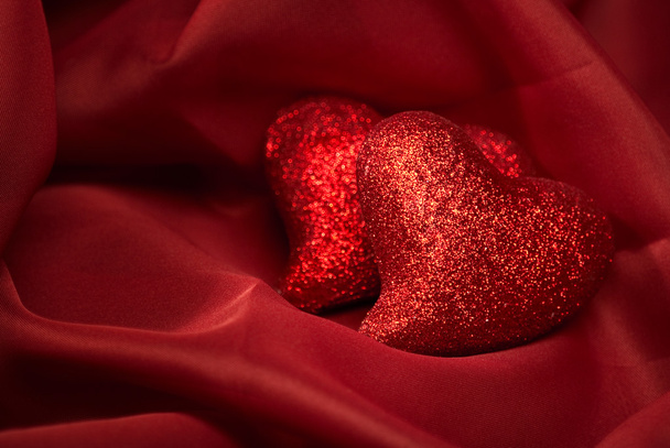 Abstract Valentine's backgrounds over red textile with tho heart - Фото, зображення