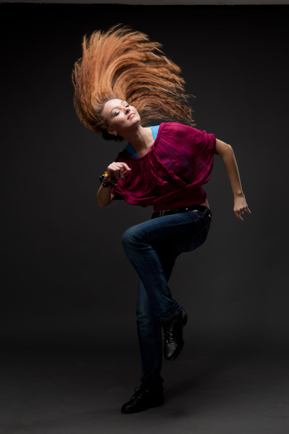 Attractive young woman dancing - Fotó, kép