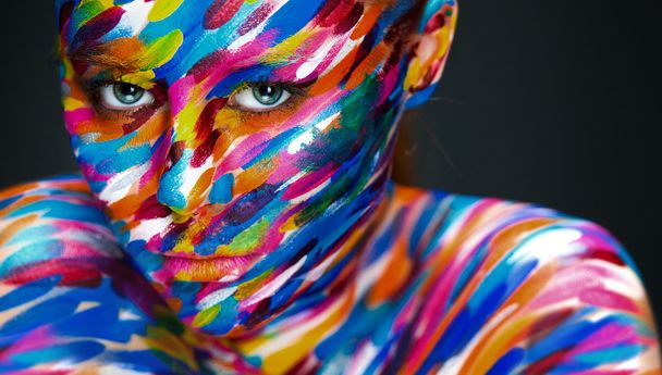 Bright beautiful girl with art colorful make-up and bodyart - Photo, image